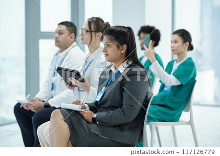 Doctors Sitting At Medical Conference Doctors Sitting At Medical Conference 117126779
