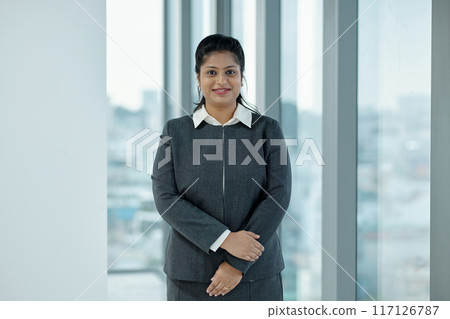 Confident Businesswoman In Suit In Office 117126787