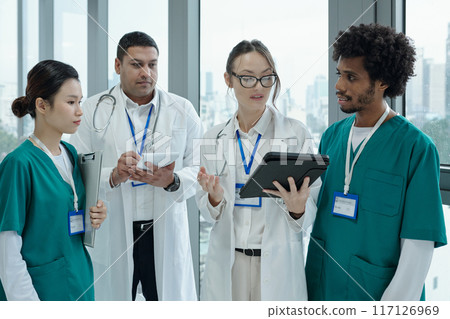 Doctors Using Digital Tablet At Work 117126969