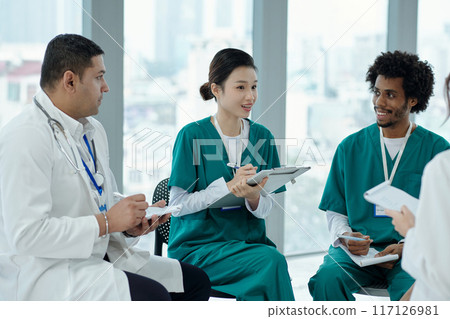 Doctors Sitting Together At Meeting Doctors Sitting Together At Meeting 117126981