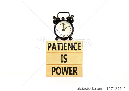 Patience is power symbol. Concept words Patience is power on beautiful wooden blocks. Beautiful white table white background. Black alarm clock. Business and patience is power concept. Copy space. 117129341