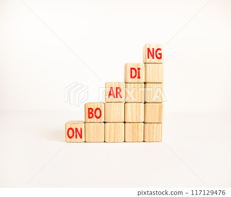 Onboarding success symbol. Concept word Onboarding on wooden blocks. Beautiful white background. Business onboarding success concept. Copy space. 117129476