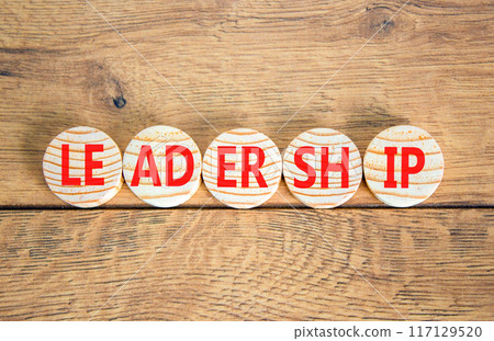Leadership symbol. Concept word Leadership on beautiful wooden circles. Beautiful wooden background. Business leadership concept. Copy space. 117129520