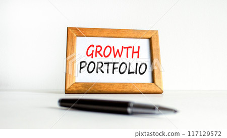 Growth portfolio symbol. Concept words Growth portfolio on beautiful wooden picture frame. Beautiful white paper background. Black pen. Business Growth portfolio concept. Copy space. 117129572
