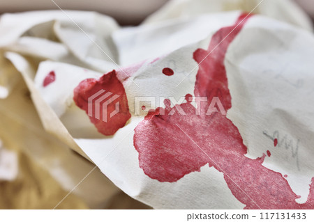 Red stains of blood on paper 117131433