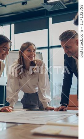 Team of business investors is discussing a new project in modern office. Concept of financing Team of business investors is discussing a new project in modern office. Concept of financing 117132358