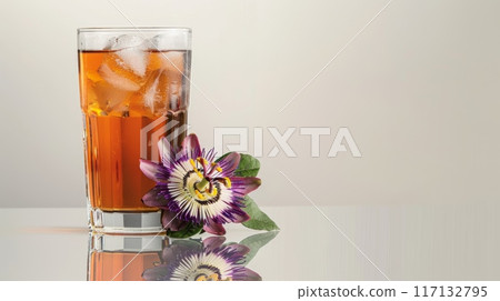 Refreshing Iced Tea with Vibrant Passion Flowers on Reflective Surface 117132795
