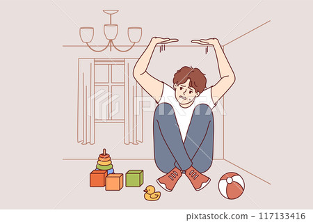 Boy suffers from claustrophobia, feeling pressure of walls and sitting in small room with toys Boy suffers from claustrophobia, feeling pressure of walls and sitting in small room with toys 117133416