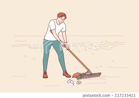 Man volunteer cleans beach of trash to prevent ocean pollution from plastic and bottles 117133421