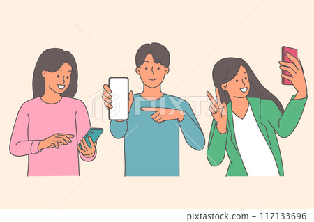 Happy teenagers use mobile gadgets and phones to surf internet or communicate on social networks 117133696