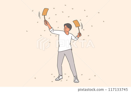 Man uses fly-flaps to fight flies and mosquitoes, flock to light at night and bite people 117133745