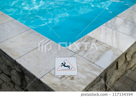 Wet floor plate is near swimming pool. Wet floor plate is near swimming pool. 117134394