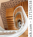 A stylish Western-style spiral staircase and white handrail 117134538