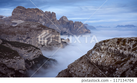 Foggy sunrise mountains in Dolomite Alps Foggy sunrise mountains in Dolomite Alps 117134704