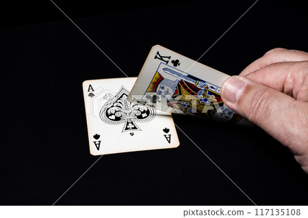 Blackjack game, winning hand. Black background. Blackjack game, winning hand. Black background. 117135108