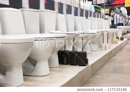 Toilet bowls in a home goods store 117135286