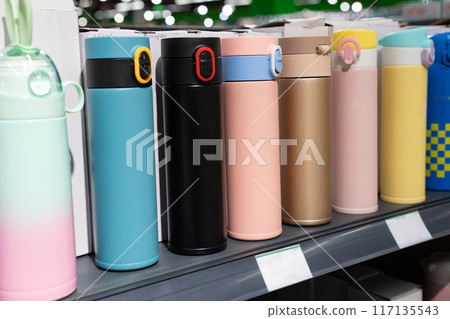 Colored thermos in the shop window Colored thermos in the shop window 117135543