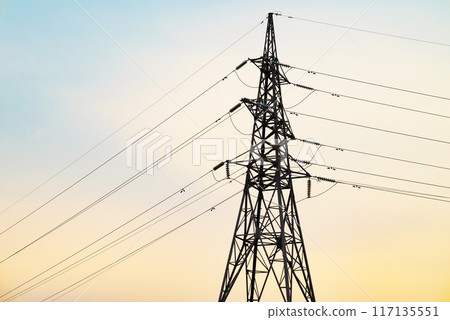 Silhouette High voltage electric tower on sunset time and sky on sunset time background. Silhouette High voltage electric tower on sunset time and sky on sunset time background. 117135551