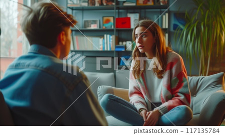 Friends engaged in deep conversation at home 117135784