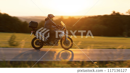 Motorcycle on the Road with Beautiful Sunset Light. Motorcycle on the Road with Beautiful Sunset Light. 117136127