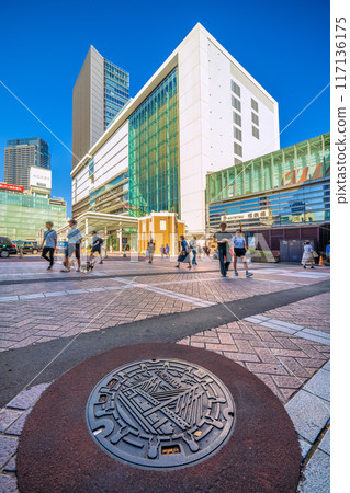 Yokohama cityscape in Japan: A manhole in front of the west exit of Yokohama Station in Yokohama City, August 4th 117136175