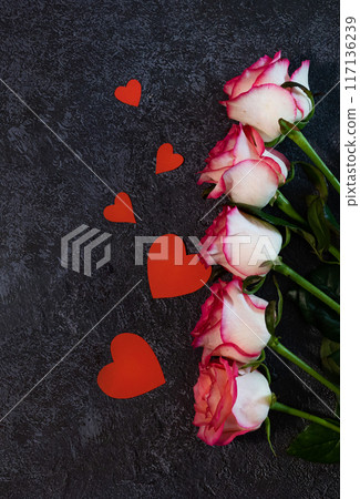Vertical Valentines Day background with blank paper card mockup, gifts, red hearts, confetti on pink. Vertical Valentines Day background with blank paper card mockup, gifts, red hearts, confetti on pink. 117136239