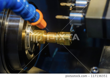 The multi tasking CNC lathe machine swiss type milling the brass fitting parts. The multi tasking CNC lathe machine swiss type milling the brass fitting parts. 117136351