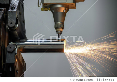 Close up scene the fiber laser cutting machine cut the stainless steel tube and sparkling light. Close up scene the fiber laser cutting machine cut the stainless steel tube and sparkling light. 117136354