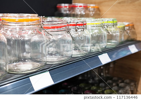 Neatly organized labeled food pantry in a home kitchen with spices grains flour rice sugar nuts Neatly organized labeled food pantry in a home kitchen with spices grains flour rice sugar nuts 117136446