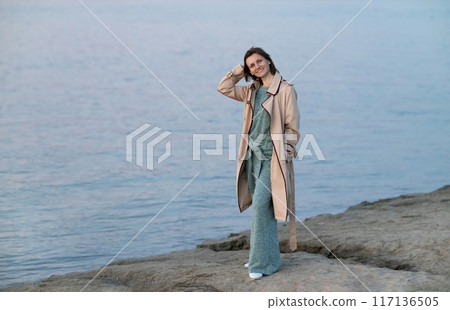 Happy young smiling woman outdoors. freedom and calm concept Happy young smiling woman outdoors. freedom and calm concept 117136505