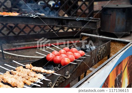 Tasty shish kebab cooking process. Grilled meat Tasty shish kebab cooking process. Grilled meat 117136615