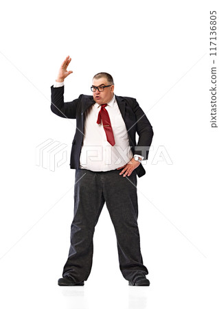 Full-length image of fat man, businessman in formal wear, red tie and glasses, standing and emotionally talking isolated on white background. Full-length image of fat man, businessman in formal wear, red tie and glasses, standing and emotionally talking isolated on white background. 117136805