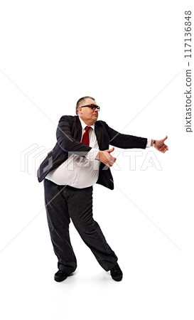 Confident man, businessman in formal wear, black suit and sunglasses, dancing isolated on white background. Positive attitude at work 117136848