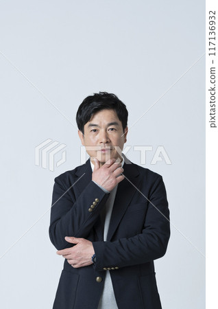 A man in his 50s thinking A man in his 50s thinking 117136932