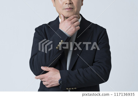 A man in his 50s thinking 117136935