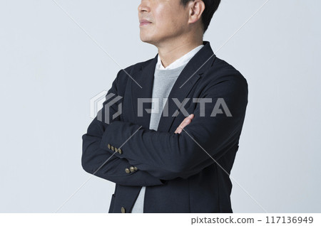A man in his 50s with his arms folded A man in his 50s with his arms folded 117136949