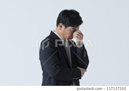 A man in his 50s with a serious expression A man in his 50s with a serious expression 117137203