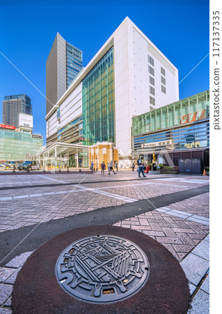 Yokohama cityscape in Japan: A manhole in front of the west exit of Yokohama Station in Yokohama City, August 4th 117137335