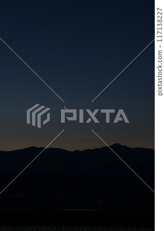 A thin, 28.0 day old moon over the Okuchichibu mountain range seen from Hakushu Town, Hokuto City A thin, 28.0 day old moon over the Okuchichibu mountain range seen from Hakushu Town, Hokuto City 117138227