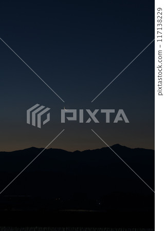 A thin, 28.0 day old moon over the Okuchichibu mountain range seen from Hakushu Town, Hokuto City A thin, 28.0 day old moon over the Okuchichibu mountain range seen from Hakushu Town, Hokuto City 117138229