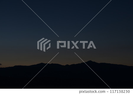 A thin, 28.0 day old moon over the Okuchichibu mountain range seen from Hakushu Town, Hokuto City A thin, 28.0 day old moon over the Okuchichibu mountain range seen from Hakushu Town, Hokuto City 117138230