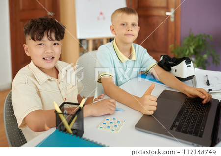 Smiling Boys Working Together on Digital Project Smiling Boys Working Together on Digital Project 117138749