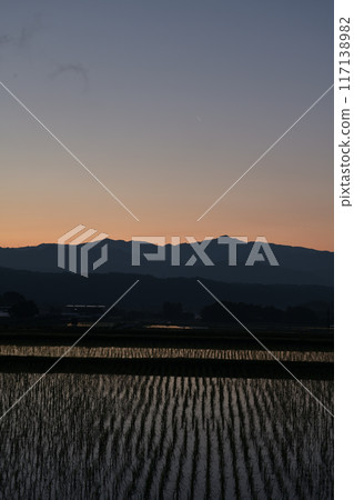 A thin moon during the magic hour at dawn as seen from Hakushu Town, Hokuto City 117138982