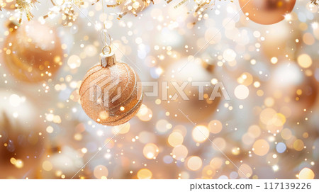 Christmas ornaments hanging on tree branch with golden bokeh background 117139226