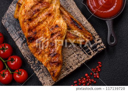 Delicious fresh grilled chicken fillet with spices and herbs Delicious fresh grilled chicken fillet with spices and herbs 117139720