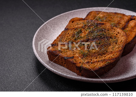 Delicious crispy croutons or bruschetta from brown bread 117139810