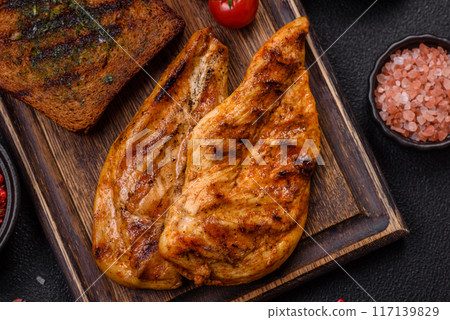 Delicious fresh grilled chicken fillet with spices and herbs 117139829