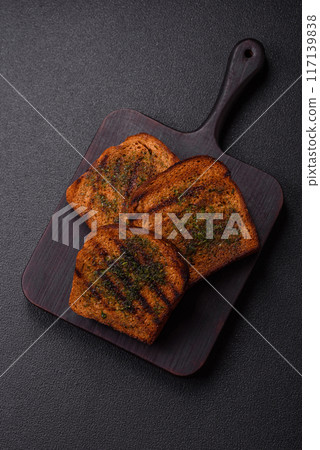 Delicious crispy croutons or bruschetta from brown bread Delicious crispy croutons or bruschetta from brown bread 117139838