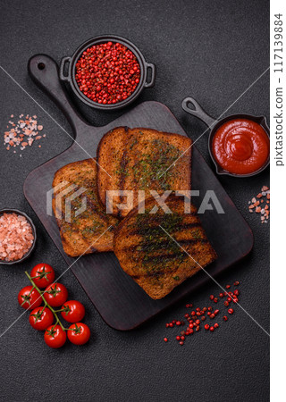 Delicious crispy croutons or bruschetta from brown bread Delicious crispy croutons or bruschetta from brown bread 117139884