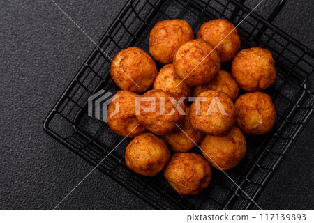 Delicious crispy balls breaded with mozzarella cheese, salt and spices 117139893